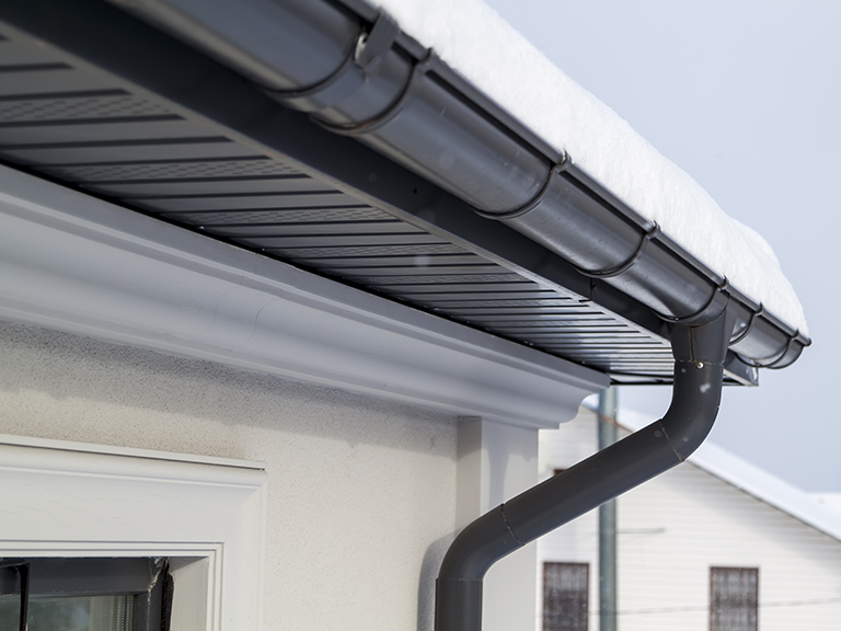 Roof Gutter filled with Snow
